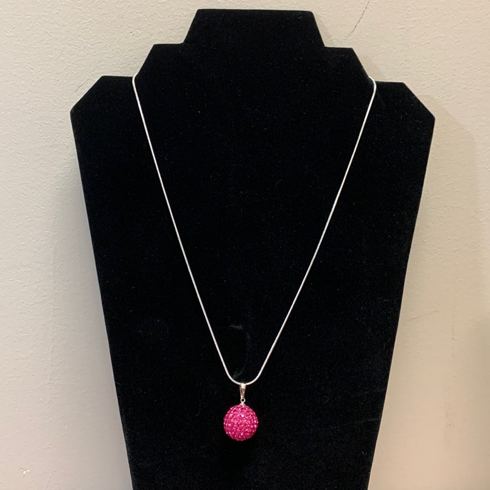 Silver tone necklace with large pink sparkle globe